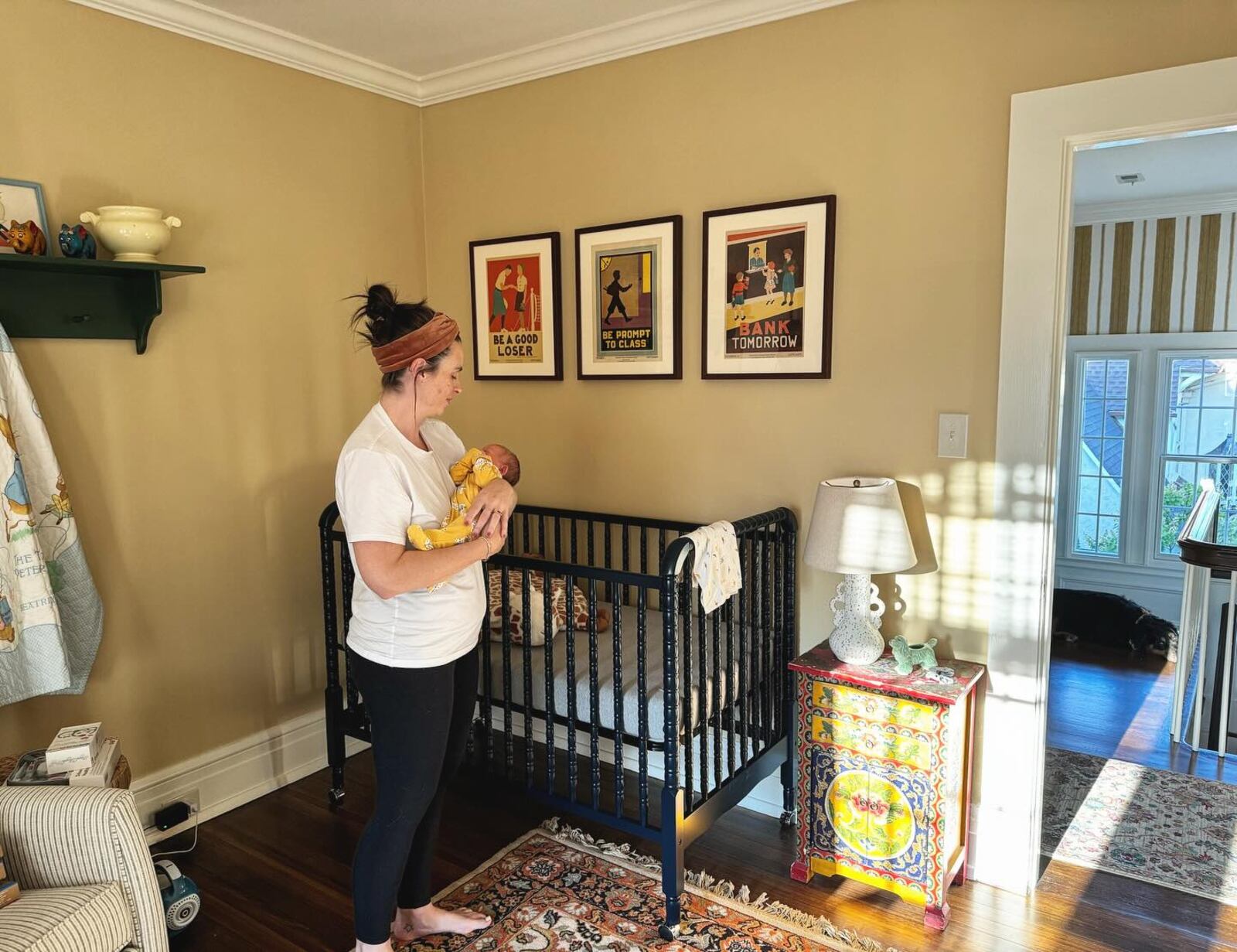 Jackson's son Perry was born in October of last year. She is shown holding him in his nursery in their home in Oakwood.