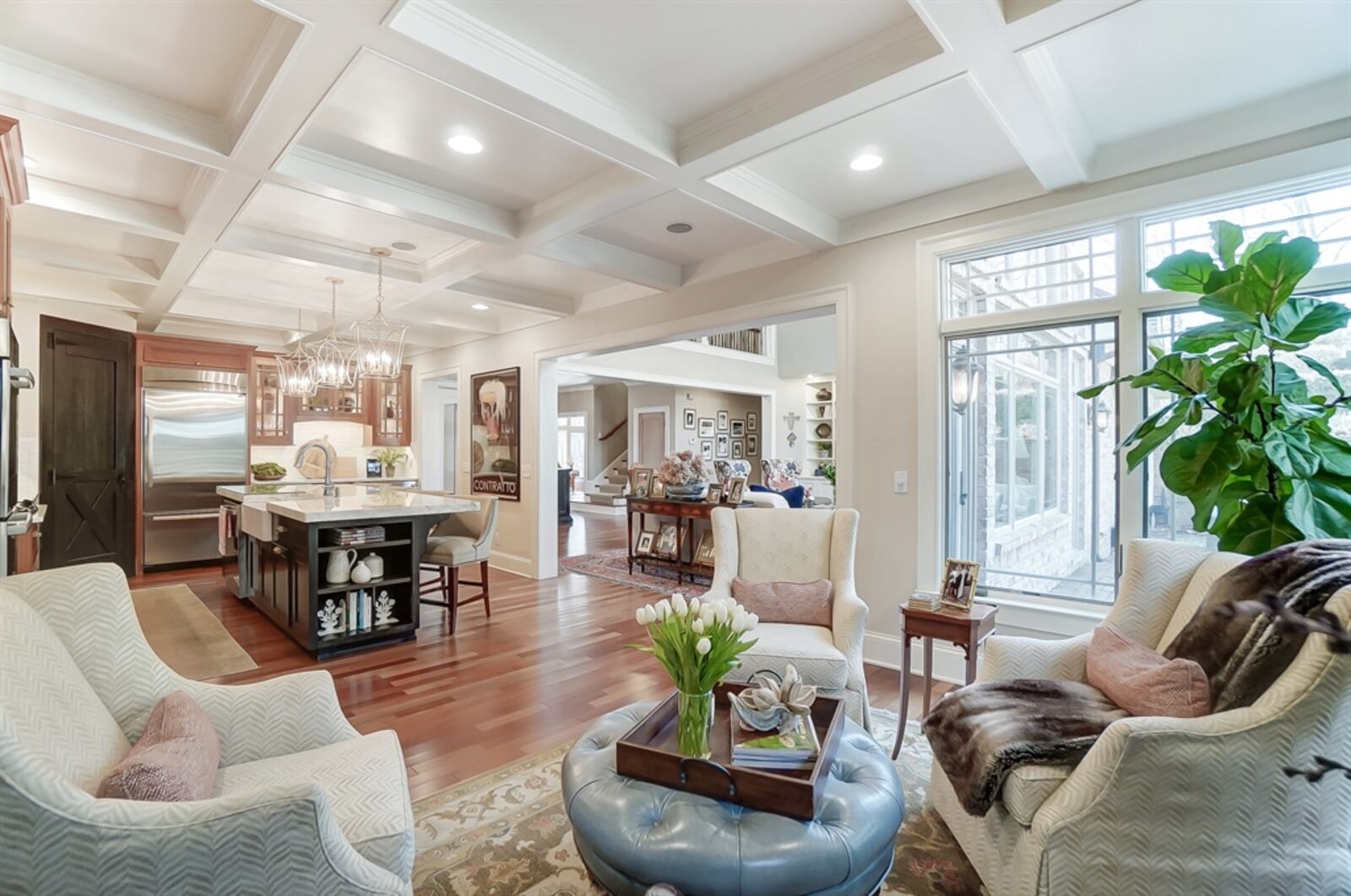 The great room flows into the combined hearth room and kitchen. 