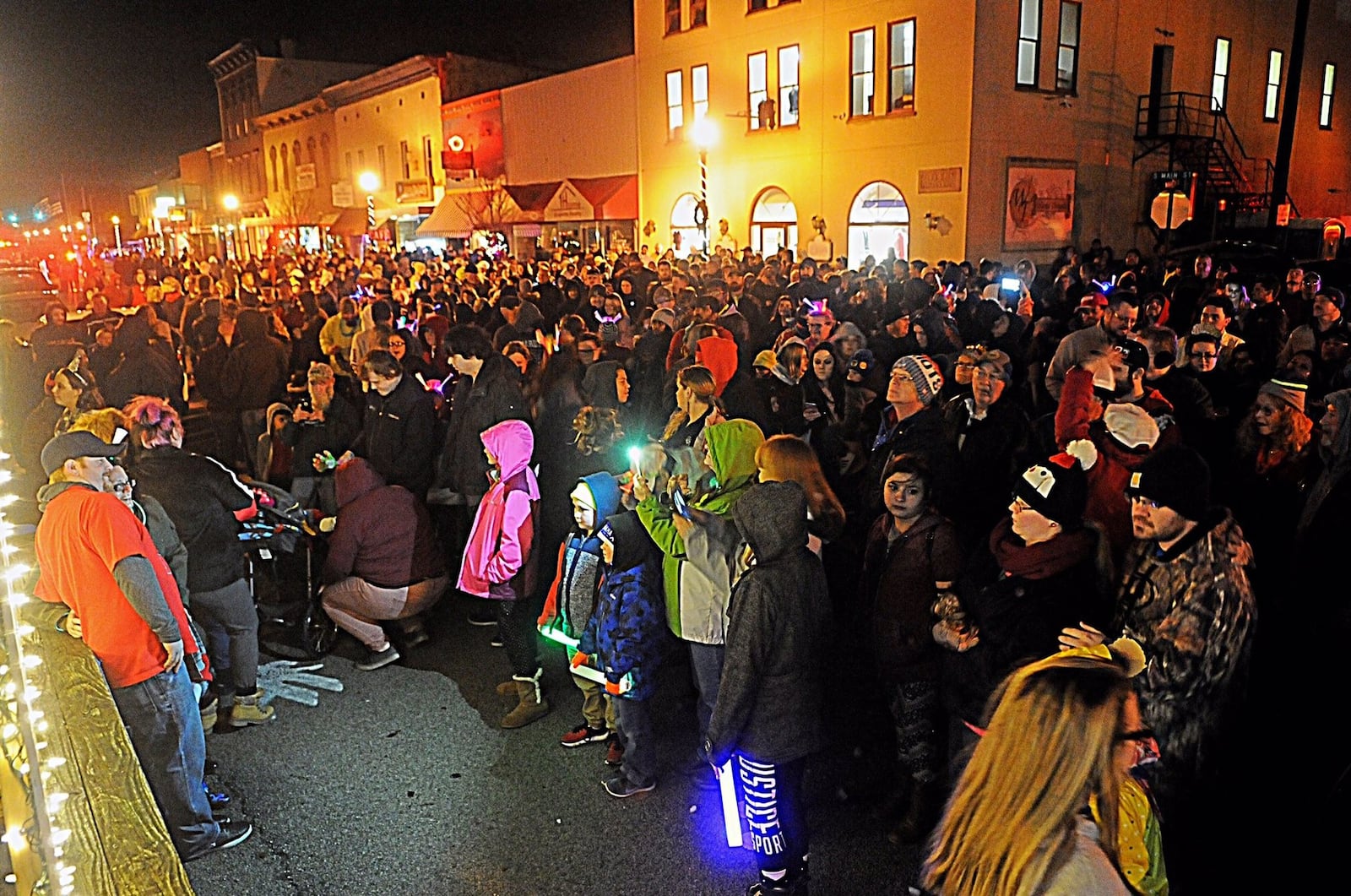 Thousands of people line Main Street in anticipation of last year’s ball drop on New Year’s Eve in New Carlisle. MARSHALL GORBY/STAFF