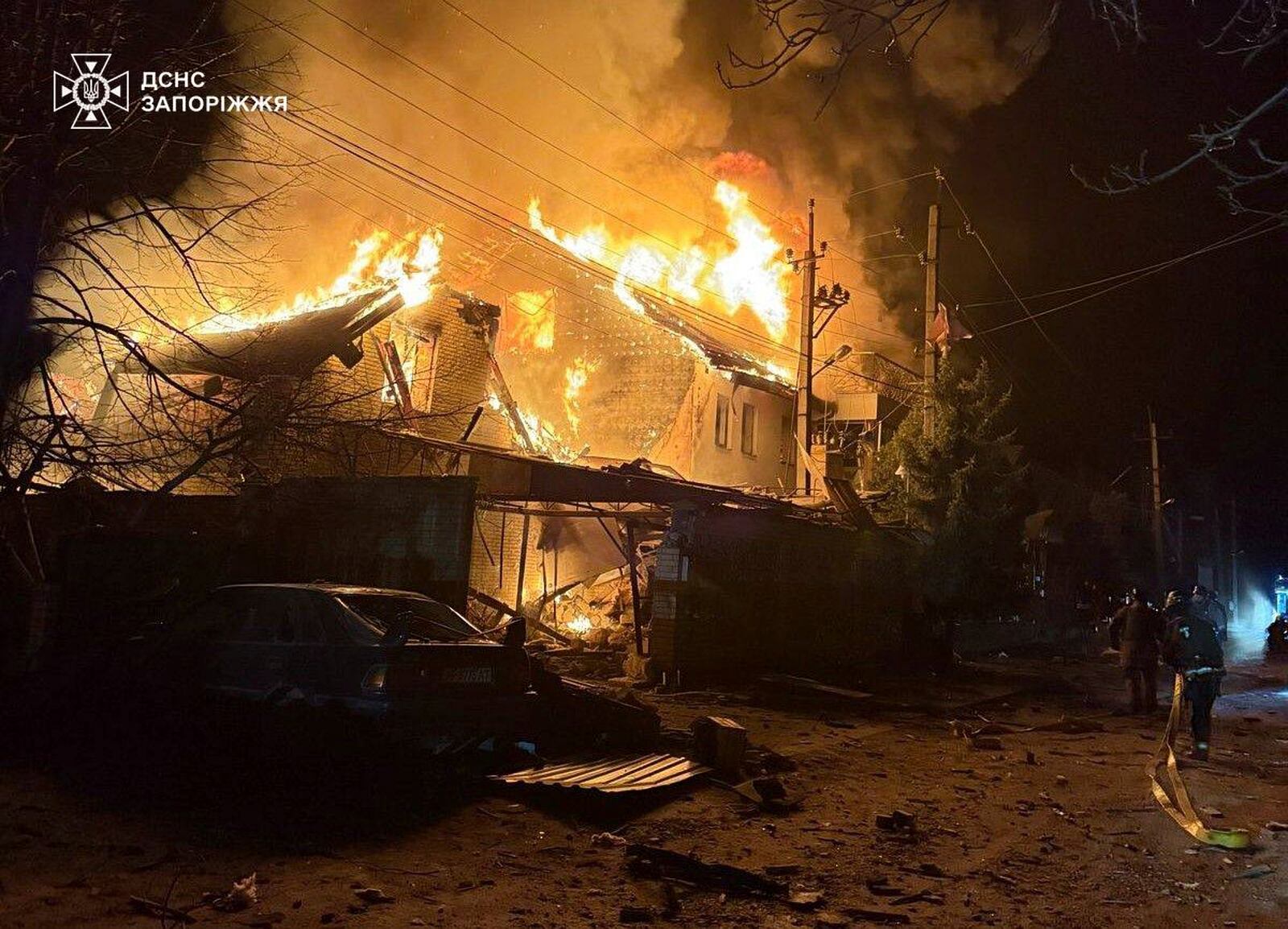 In this photo provided by the Ukrainian Emergency Service, firefighters try to put out a fire following a Russian attack in Zaporizhzhia, Ukraine, Friday, March 21, 2025. (Ukrainian Emergency Service via AP)