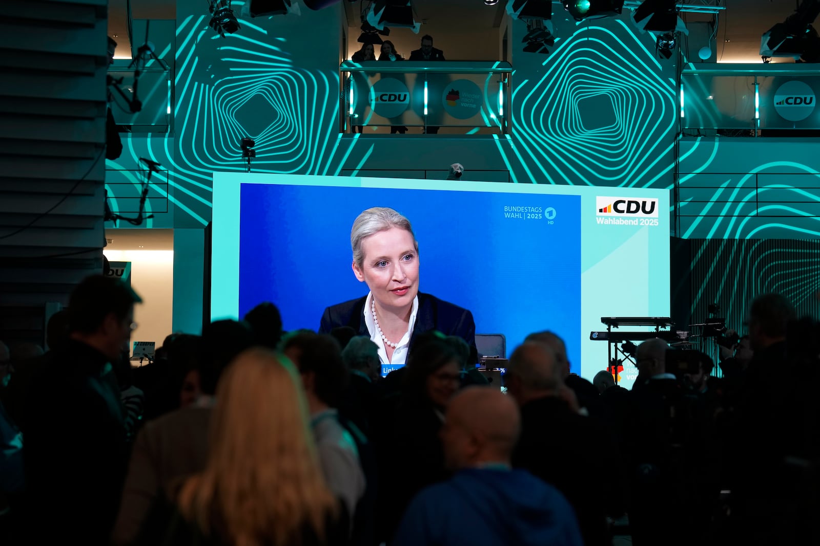 A video screen at the Christian Democratic Union party headquarters shows Alice Weidel, of the far-right, anti-immigration Alternative for Germany, or AfD, taking part in a post-election debate, in Berlin, Germany, Sunday, Feb. 23, 2025. (AP Photo/Markus Schreiber)