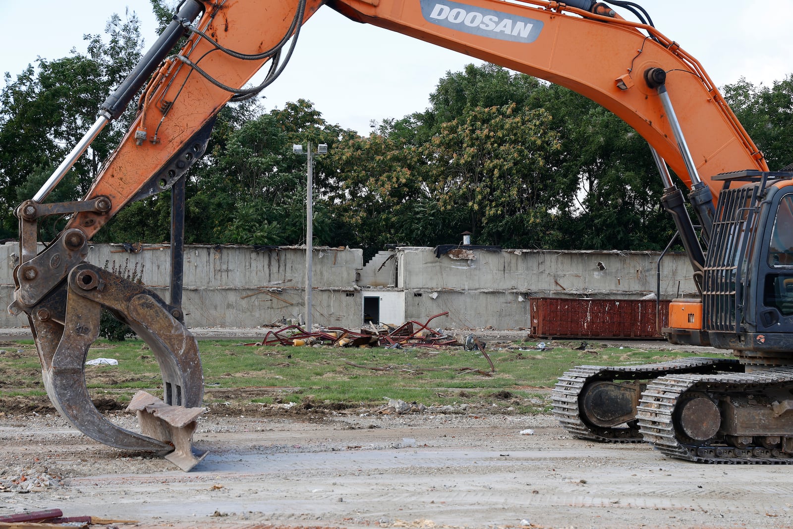 The only thing left of the former Villager Inn hotel is the sign and the back wall Tuesday, August 29, 2023. BILL LACKEY/STAFF