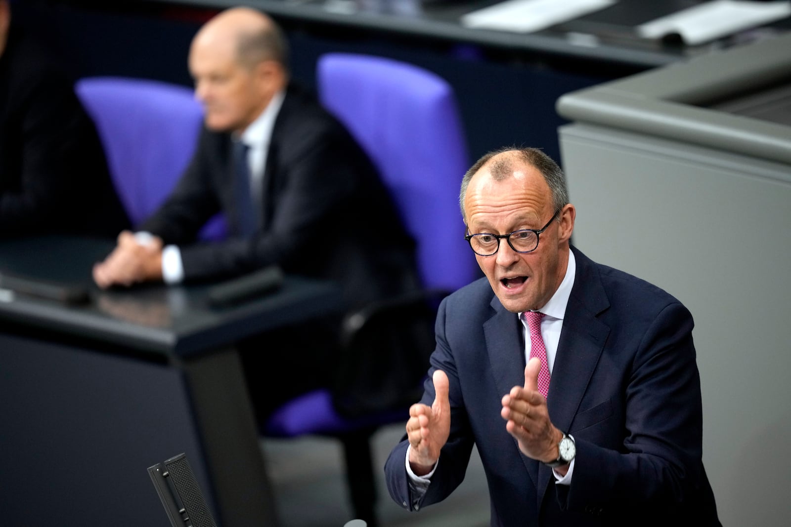 FILE - Opposition Christian Union parties floor leader Friedrich Merz, right, speaks, as German Chancellor Olaf Scholz, listens during a general debate on the budget at the German parliament Bundestag in Berlin, Germany, Wednesday, Jan. 31, 2024. (AP Photo/Ebrahim Noroozi, File)