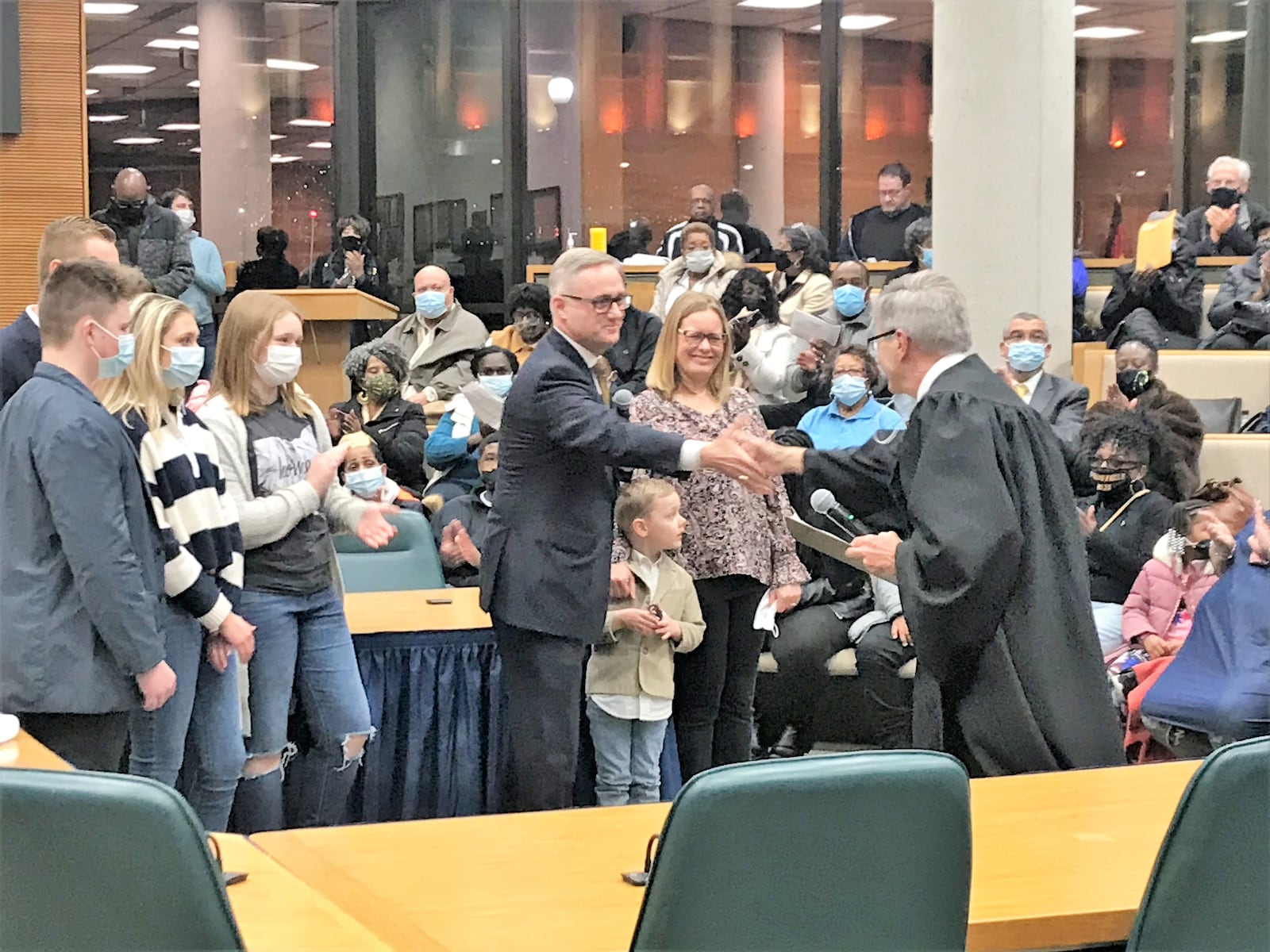 Recently reelected Springfield City Commissioner Rob Rue is joined by his family after taking an oath of office after being selected to serve as assistant mayor. Hasan Karim/Staff