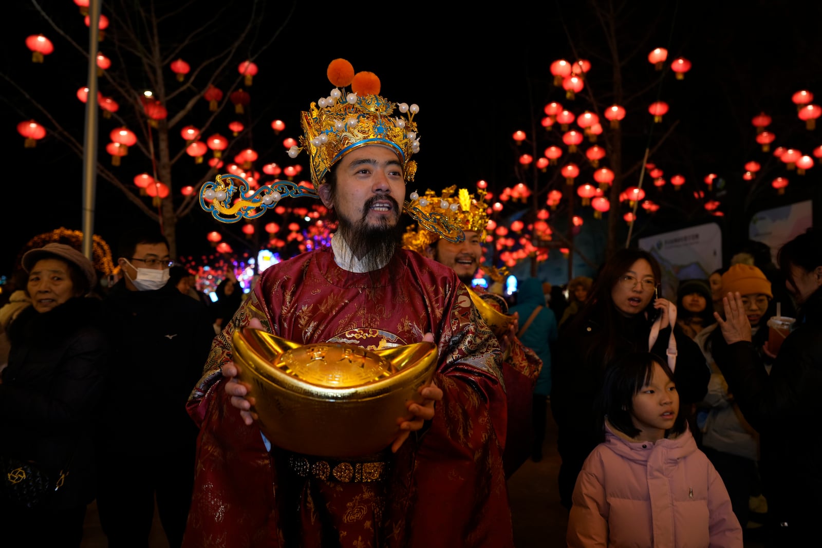 The God of Fortune leads a parade to offer blessings at the Lantern Festival during Yuanxiao, the fifteen day of the Lunar New Year in Beijing, Wednesday, Feb. 12, 2025. (AP Photo/Ng Han Guan)