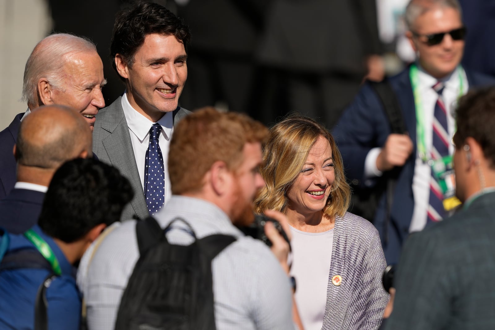 U.S. President Joe Biden, top left, Canada's Prime Minister Justin Trudeau, second from top left, and Italy's Prime Minister Giorgia Meloni arrive late for the group photo at the G20 Summit in Rio de Janeiro, Monday, Nov. 18, 2024. (AP Photo/Eraldo Peres)