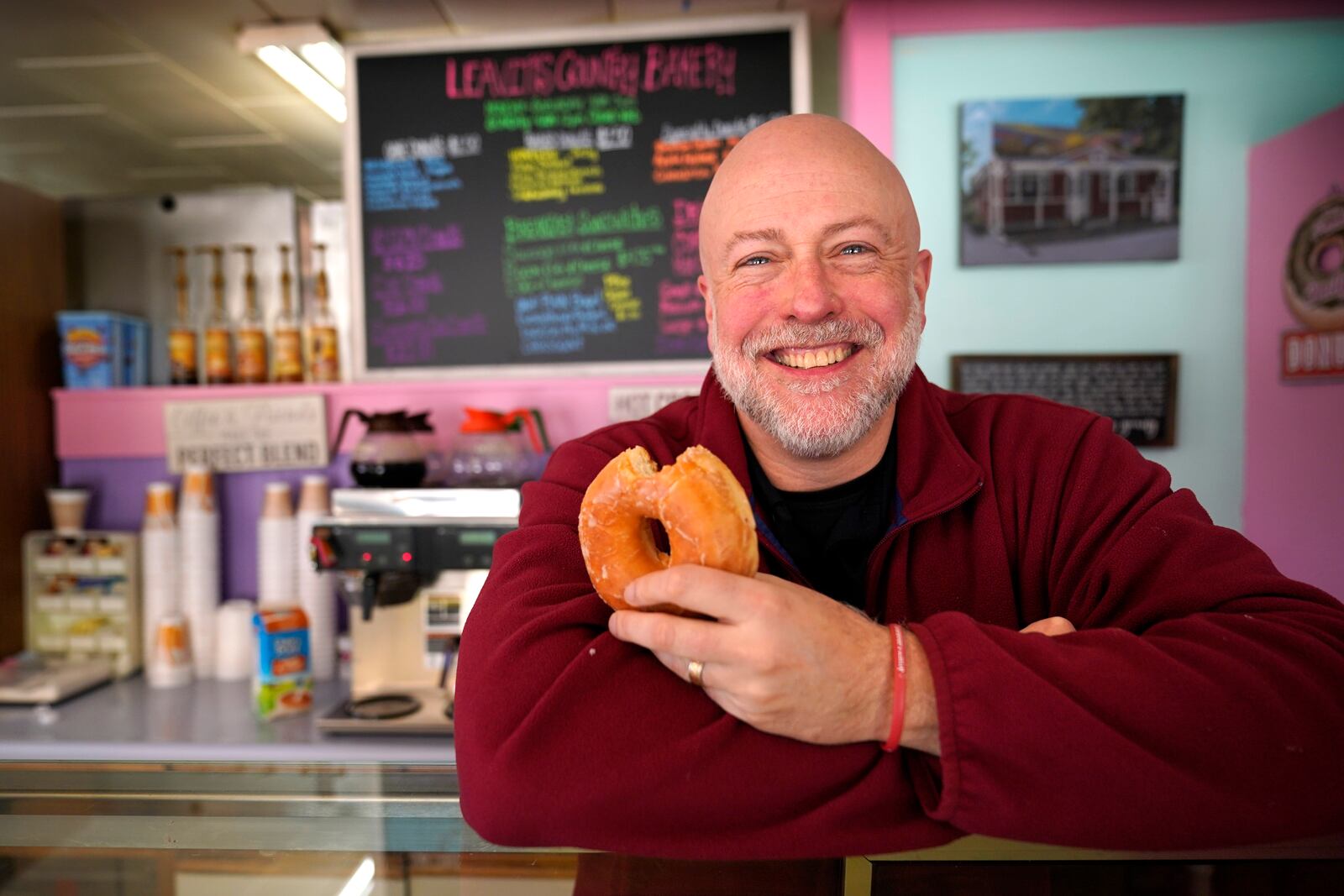 FILE - Owner Sean Young poses at Leavitt's Country Bakery, in this April 13, 2023 file photo, in Conway, N.H. (AP Photo/Robert F. Bukaty, file)