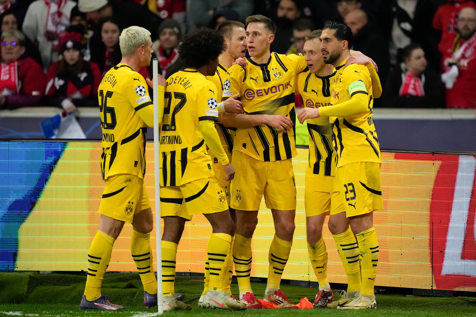 Dortmund players celebrate after a goal during the Champions League round of 16 second leg soccer match between Lille and Borussia Dortmund in Villeneuve-d'Ascq , Wednesday, March 12, 2025. (AP Photo/Michel Euler)