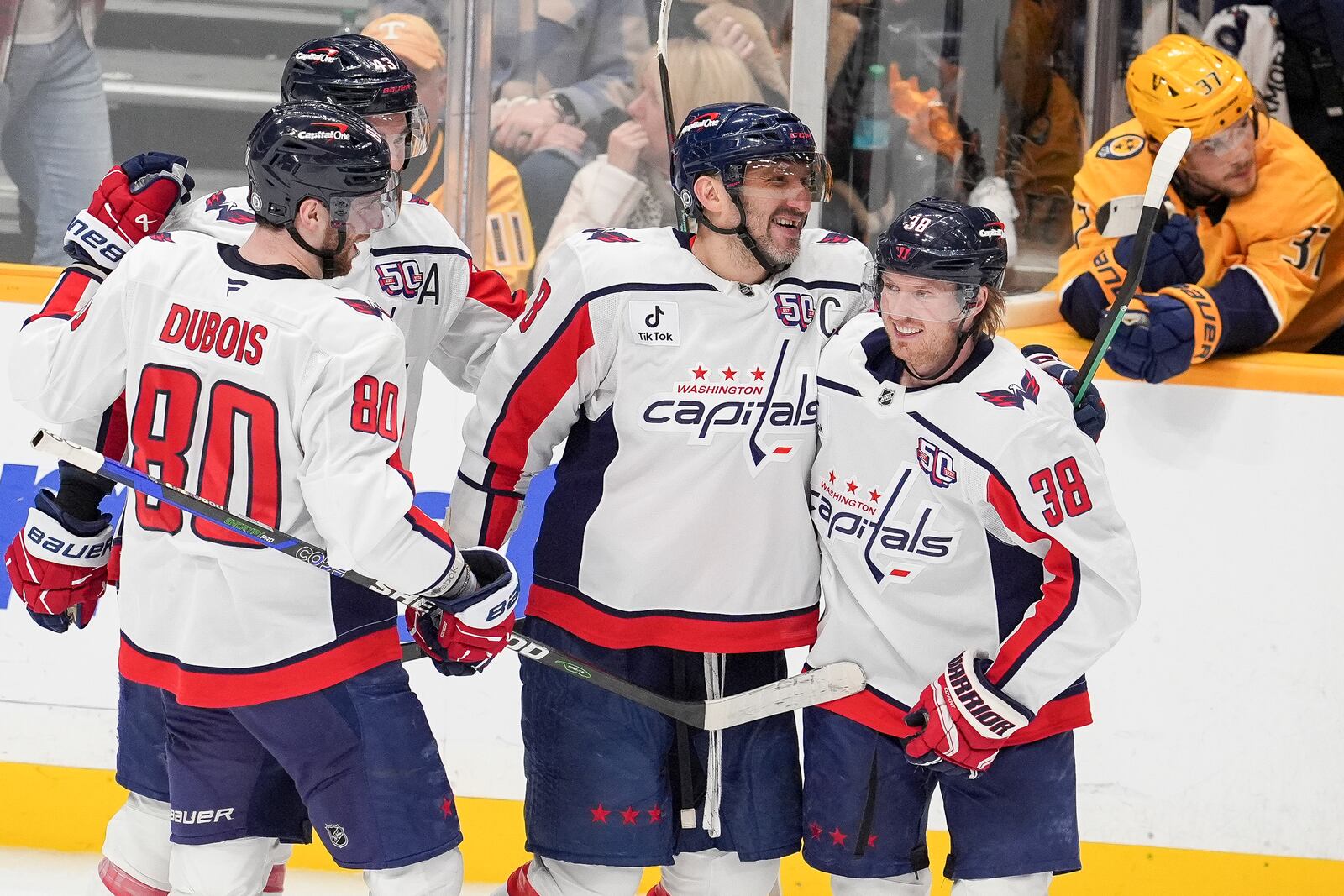 Washington Capitals left wing Alex Ovechkin, second from right, celebrates his empty net goal with teammates during the third period of an NHL hockey game against the Nashville Predators, Saturday, Jan. 11, 2025, in Nashville, Tenn. The Capitals won 4-1. (AP Photo/George Walker IV)