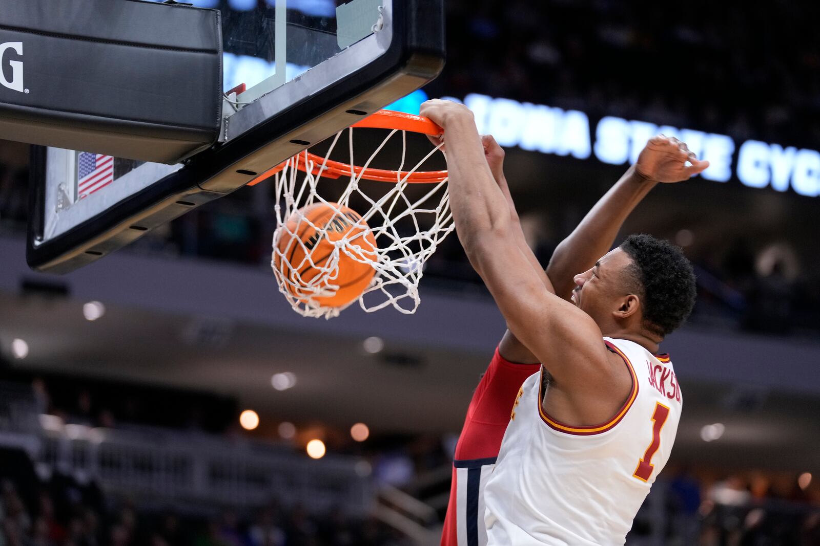 Mississippi forward Mikeal Brown-Jones (1) dunks the ball against guard Matthew Murrell, back, during the second half in the second round of the NCAA college basketball tournament, Sunday, March 23, 2025, in Milwaukee. (AP Photo/Kayla Wolf)