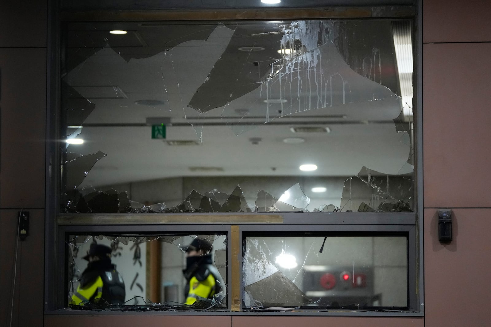 Police officers patrol inside Seoul Western District Court after supporters of impeached South Korean President Yoon Suk Yeol broke into the court in Seoul, South Korea, Sunday, Jan. 19, 2025. (AP Photo/Ahn Young-joon)