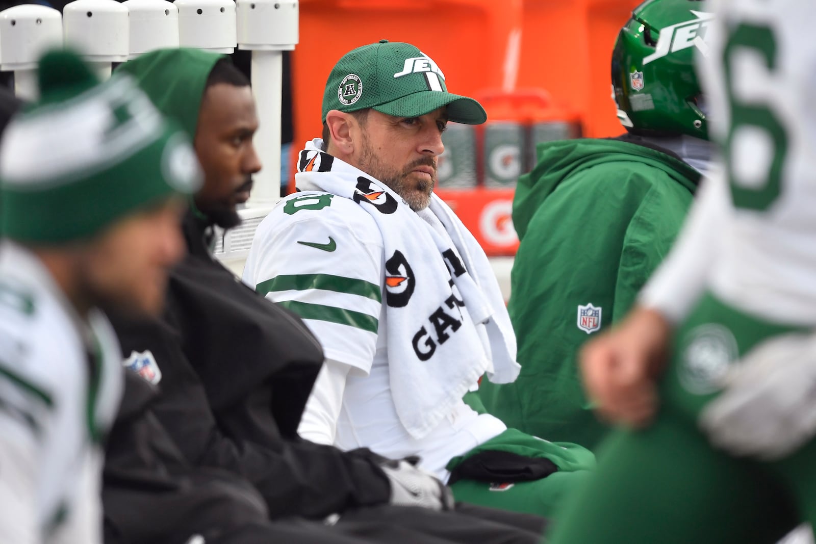 New York Jets quarterback Aaron Rodgers (8) sits on the bench during the first half of an NFL football game against the Buffalo Bills, Sunday, Dec. 29, 2024, in Orchard Park, N.Y. (AP Photo/Adrian Kraus)