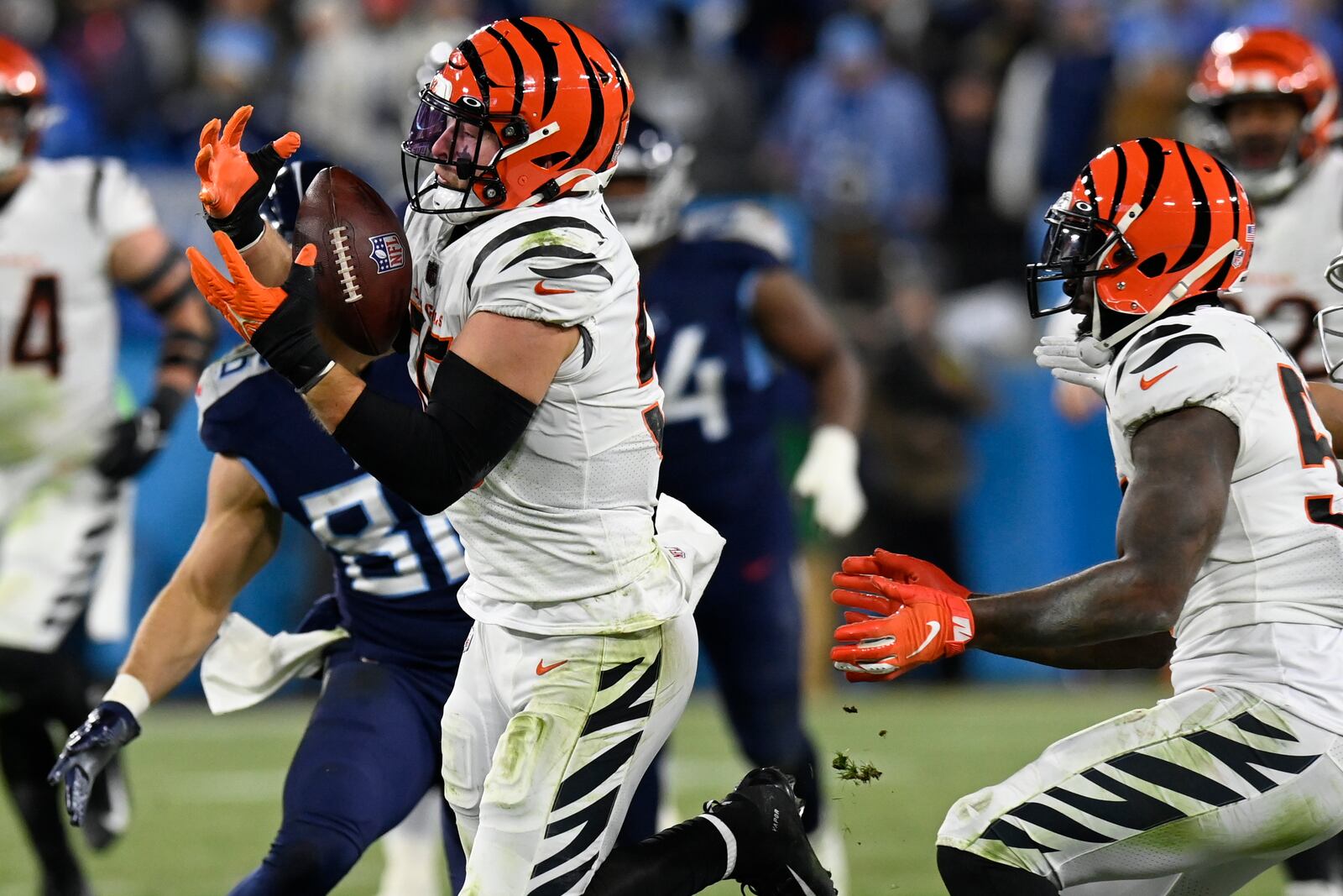 Cincinnati Bengals linebacker Logan Wilson (55) intercepts the ball against the Tennessee Titans during the second half of an NFL divisional round playoff football game, Saturday, Jan. 22, 2022, in Nashville, Tenn. (AP Photo/Mark Zaleski)