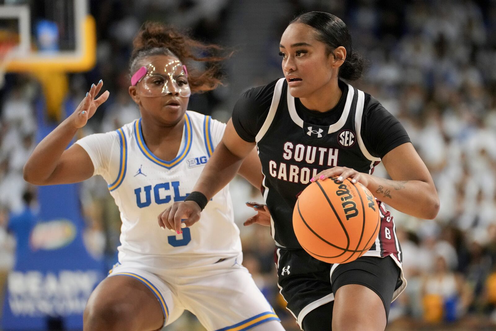 South Carolina guard Te-Hina Paopao drives against UCLA guard Londynn Jones (3) during the first half of an NCAA college basketball game, Sunday, Nov. 24, 2024, in Los Angeles. (AP Photo/Eric Thayer)