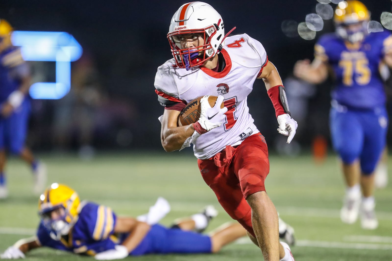 Southeastern High School junior Cole Dent carries the ball during their game against Lehman Catholic on Saturday night at Sidney Memorial Stadium. CONTRIBUTED PHOTO BY MICHAEL COOPER