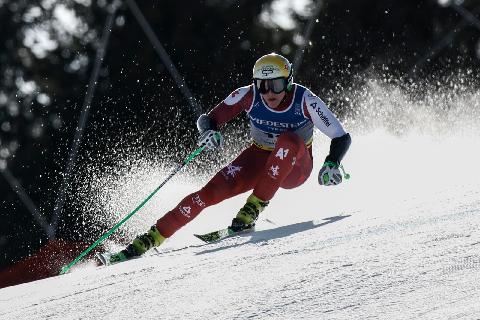 Austria's Raphael Haaser speeds down the course during a men's Super-G, at the Alpine Ski World Championships, in Saalbach-Hinterglemm, Austria, Friday, Feb. 7, 2025. (AP Photo/Gabriele Facciotti)