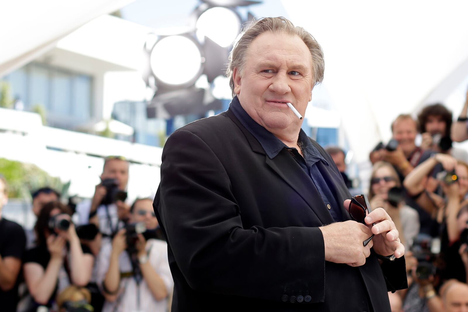 FILE - Actor Gerard Depardieu poses for photographers during a photo call for the film Valley of Love, at the 68th international film festival, Cannes, southern France, on May 22, 2015. (AP Photo/Thibault Camus, File)