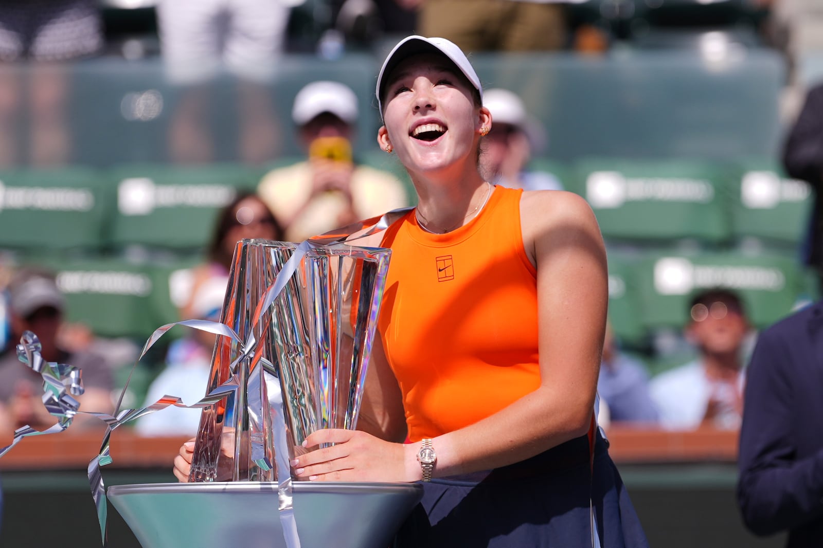 Mirra Andreeva, of Russia, holds the winner's trophy at the BNP Paribas Open tennis tournament Sunday, March 16, 2025, in Indian Wells, Calif. (AP Photo/Mark J. Terrill)