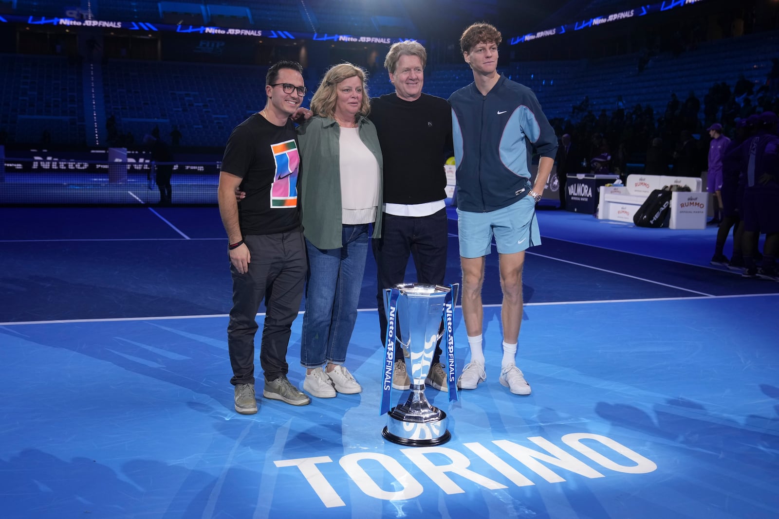 Italy's Jannik Sinner poses with his father Johann, mother Siglinde, and brother Mark, after winning the final match of the ATP World Tour Finals against Taylor Fritz of the United States at the Inalpi Arena, in Turin, Italy, Sunday, Nov. 17, 2024. (AP Photo/Antonio Calanni)