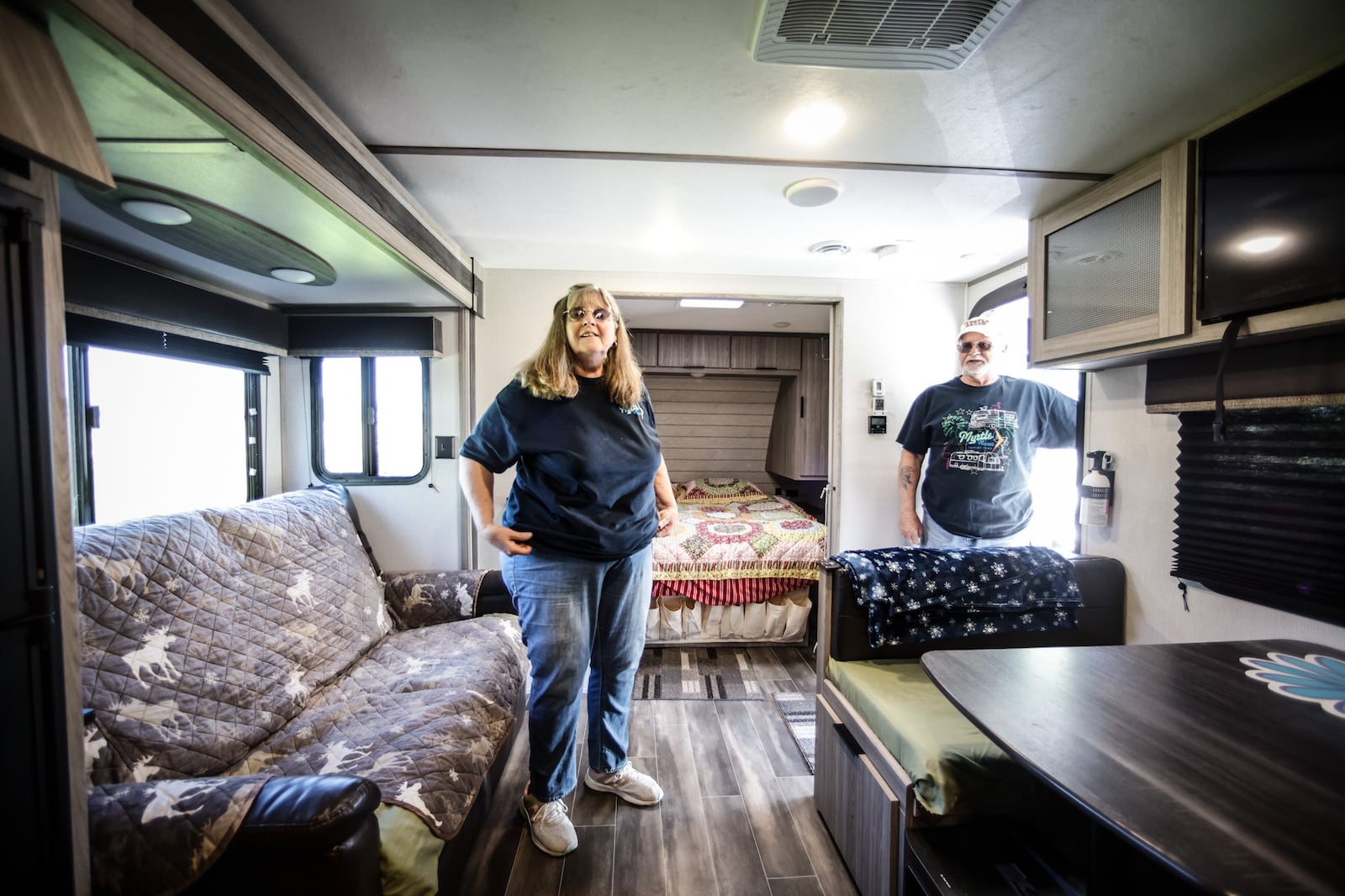 Marty and Donnie Vaughn show-off their second camper home. The couple travel camp 100 days out of the year.  JIM NOELKER/STAFF