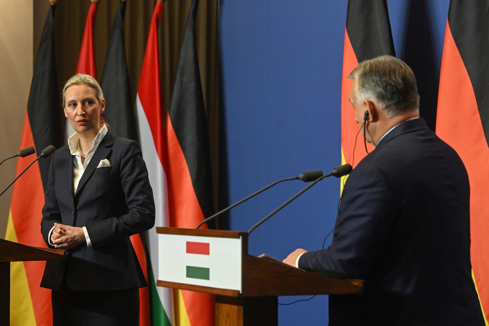 Alice Weidel, the Alternative for Germany (AfD) party's candidate for chancellor, left, and Hungarian Prime Minister Viktor Orban speak during a press conference following their meeting in the government headquarters in Budapest, Hungary, Wednesday, Feb. 12, 2025. (Szilard Koszticsak/MTI via AP)