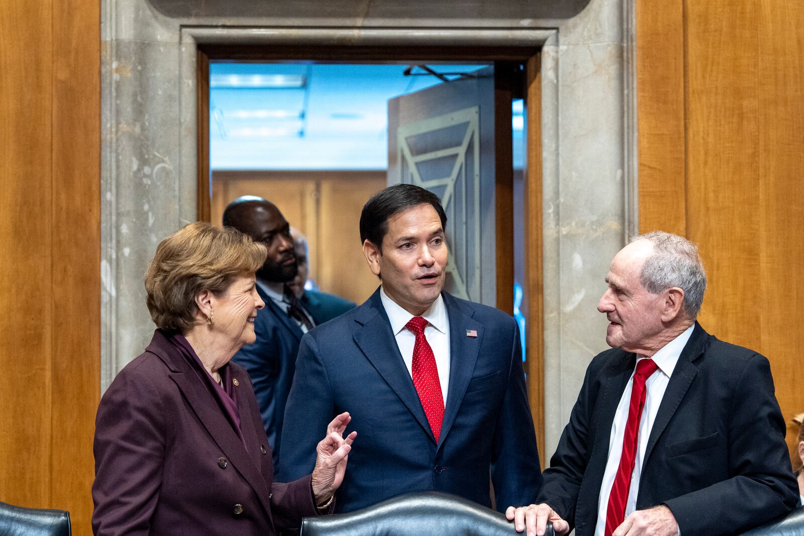 Ranking Members Sen. Jeanne Shaheen, D-N.H., left, Sen. Marco Rubio, R-Fla., President-elect Donald Trump's choice to be Secretary of State, and Chairman Jim Risch, of Idaho, arrive at the Senate Foreign Relations Committee for his confirmation hearing, at the Capitol in Washington, Wednesday, Jan. 15, 2025. (AP Photo/Alex Brandon)