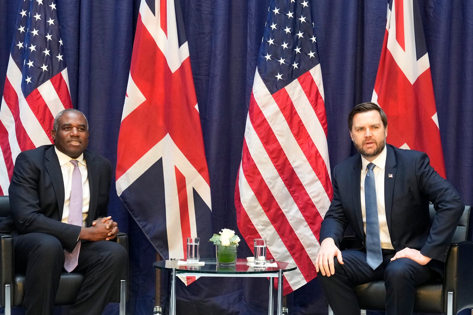 United States Vice-President JD Vance, right, and Britain's Foreign Secretary David Lammy pose for photographers during a bilateral meeting on the sidelines of the Munich Security Conference in Munich, Germany, Friday, Feb. 14, 2025. (AP Photo/Matthias Schrader)