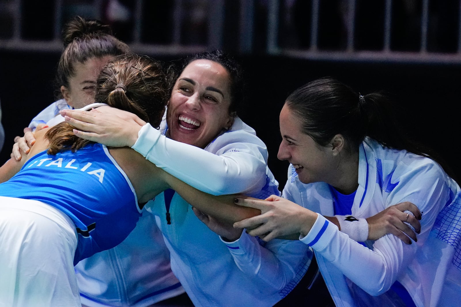 Italy's Lucia Bronzetti, left, celebrates with teammates after winning against Slovakia's Viktoria Hruncakova during the Billie Jean King Cup final at the Martin Carpena Sports Hall in Malaga, southern Spain, on Wednesday, Nov. 20, 2024. (AP Photo/Manu Fernandez)