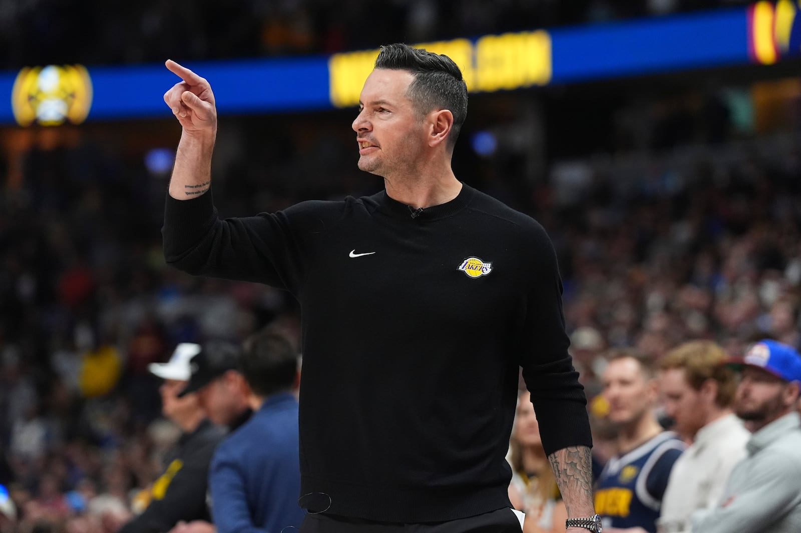 Los Angeles Lakers head coach JJ Redick directs his team against the Denver Nuggets in the first half of an NBA basketball game Saturday, Feb. 22, 2025, in Denver. (AP Photo/David Zalubowski)