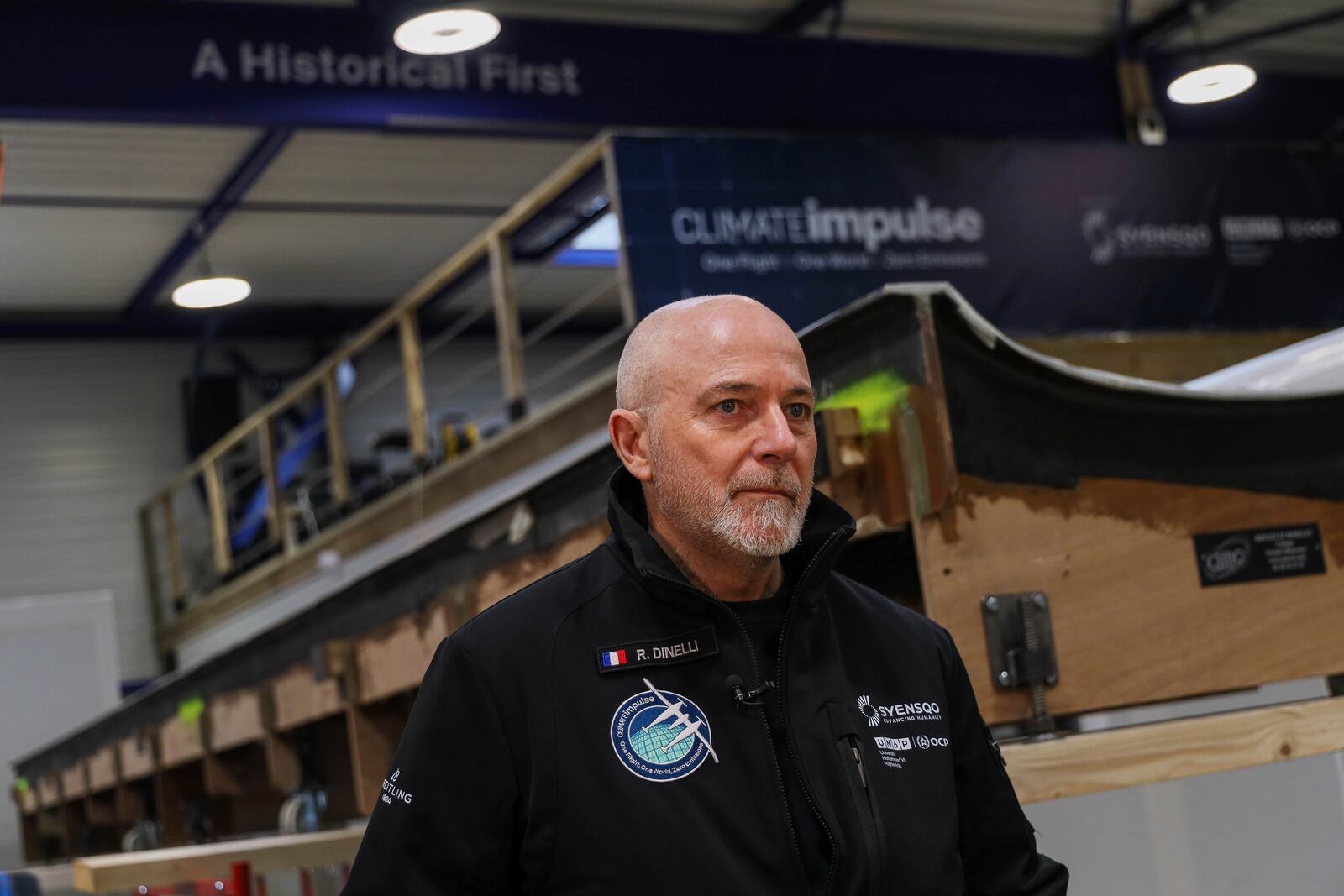 Raphael Dinelli, Climate Impulse engineer and co-pilot, explains the Climate Impulse, a plane powered by liquid hydrogen, to journalists at a hangar in Les Sables d'Olonne, France on Thursday, Feb. 13, 2025.(AP Photo/Yohan Bonnet)