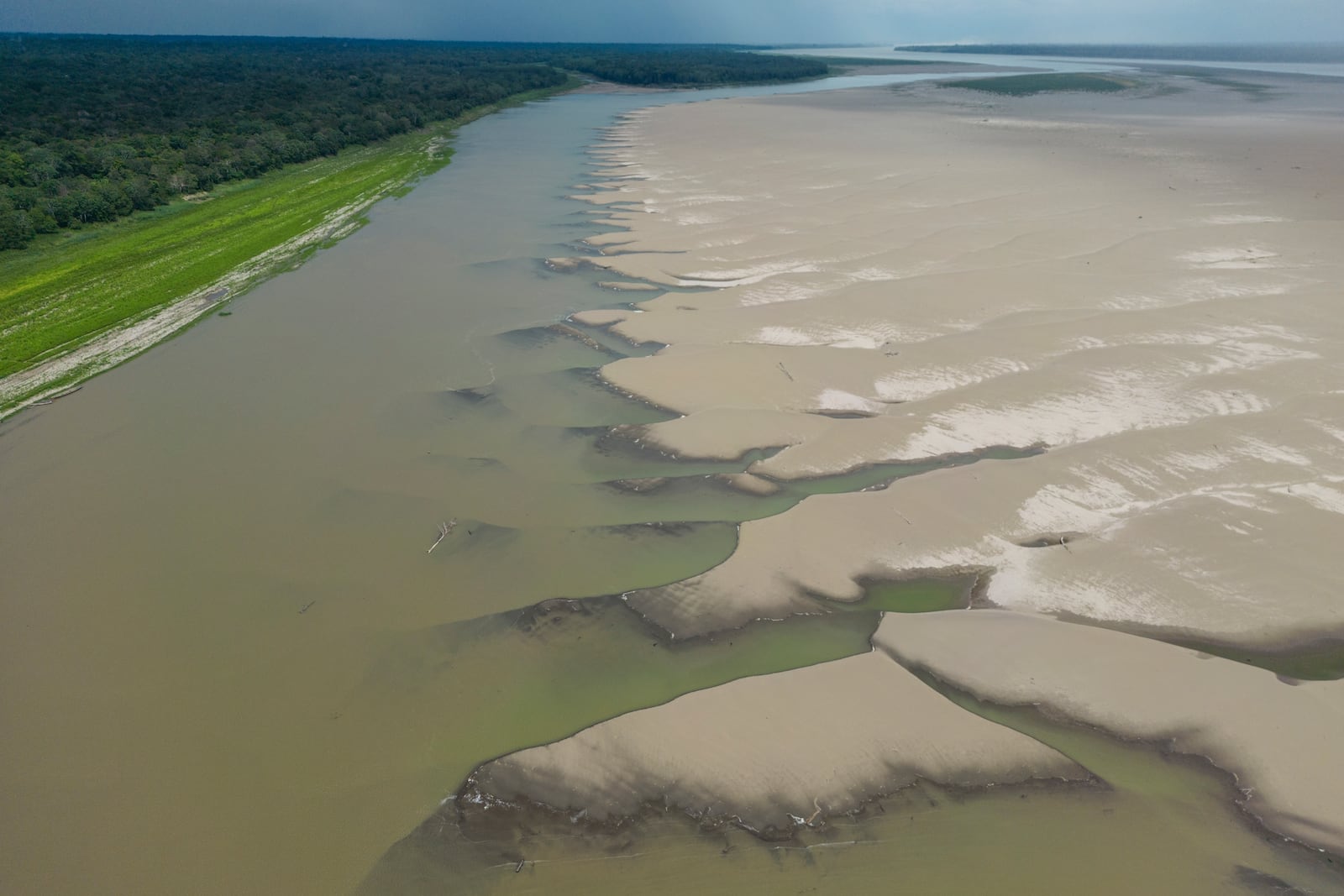 FILE - Signs of drought are visible on the Amazon River, near Santa Sofia, Colombia, Oct. 20, 2024. (AP Photo/Ivan Valencia, File)