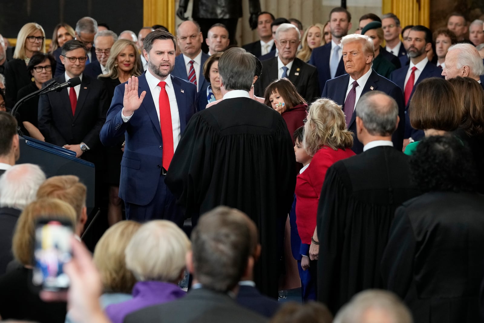 JD Vance is sworn in as vice president by Supreme Court Justice Brett Kavanaugh as Usha Vance holds the Bible during the 60th Presidential Inauguration in the Rotunda of the U.S. Capitol in Washington, Monday, Jan. 20, 2025. (AP Photo/Julia Demaree Nikhinson, Pool)