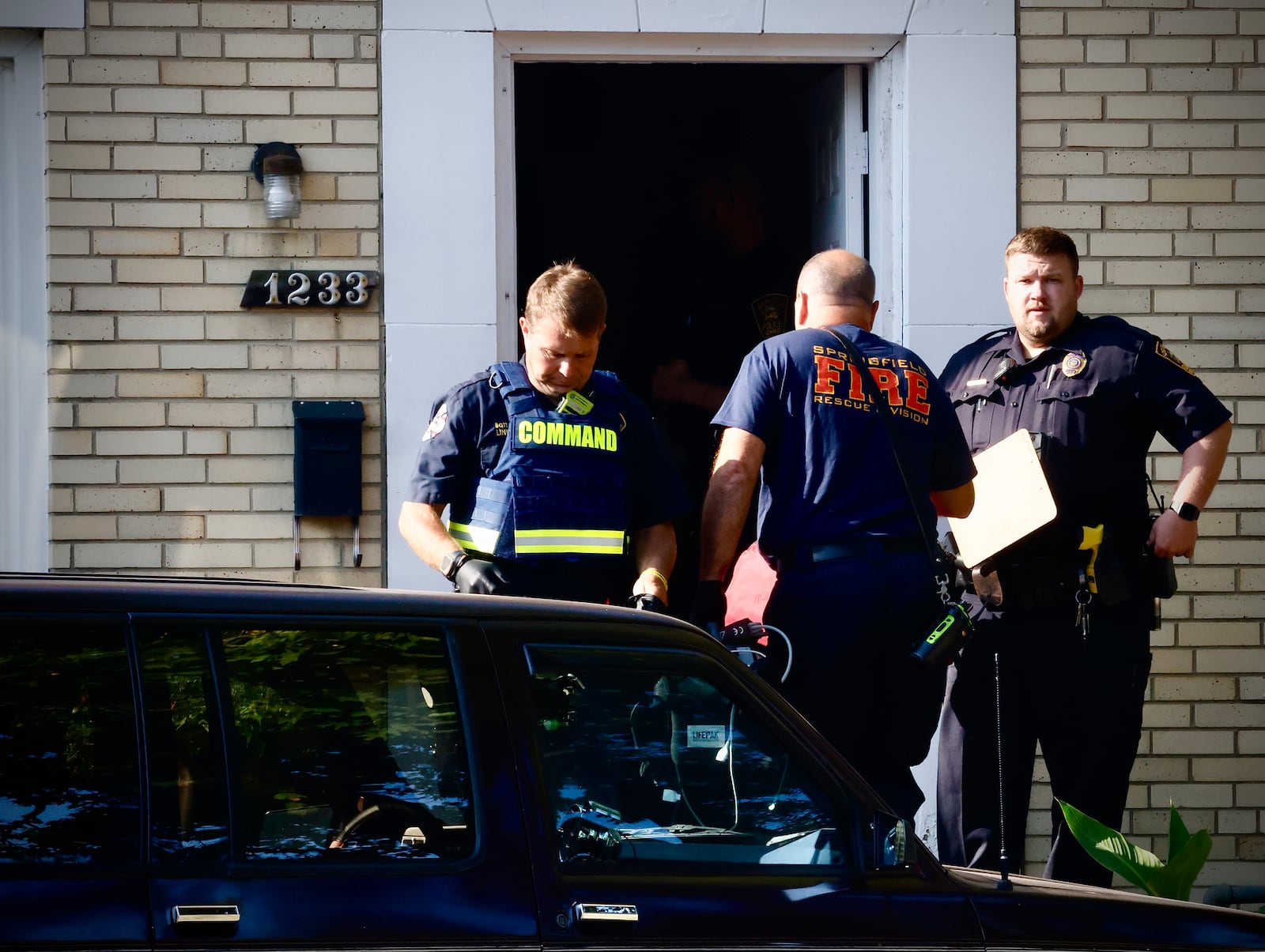 Members of the Springfield police and fire divisions respond to the scene of a shooting on West Cedarview Drive in Springfield, on Saturday morning, Sept. 14, 2024. MARSHALL GORBY \STAFF