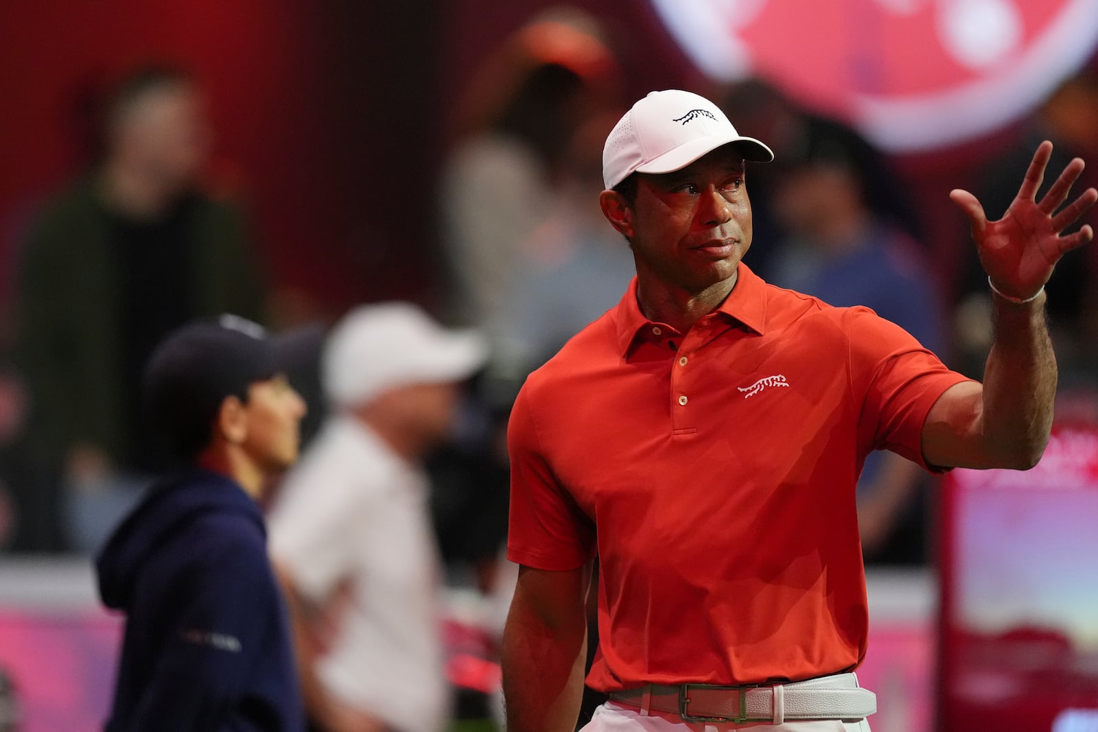 Tiger Woods of Jupiter Links Golf Club waves to fans as he is introduced at the start of a match of the TMRW Golf League (TGL) against Boston Common Golf, Monday, Jan. 27, 2025, in Palm Beach Gardens, Fla. (AP Photo/Rebecca Blackwell)