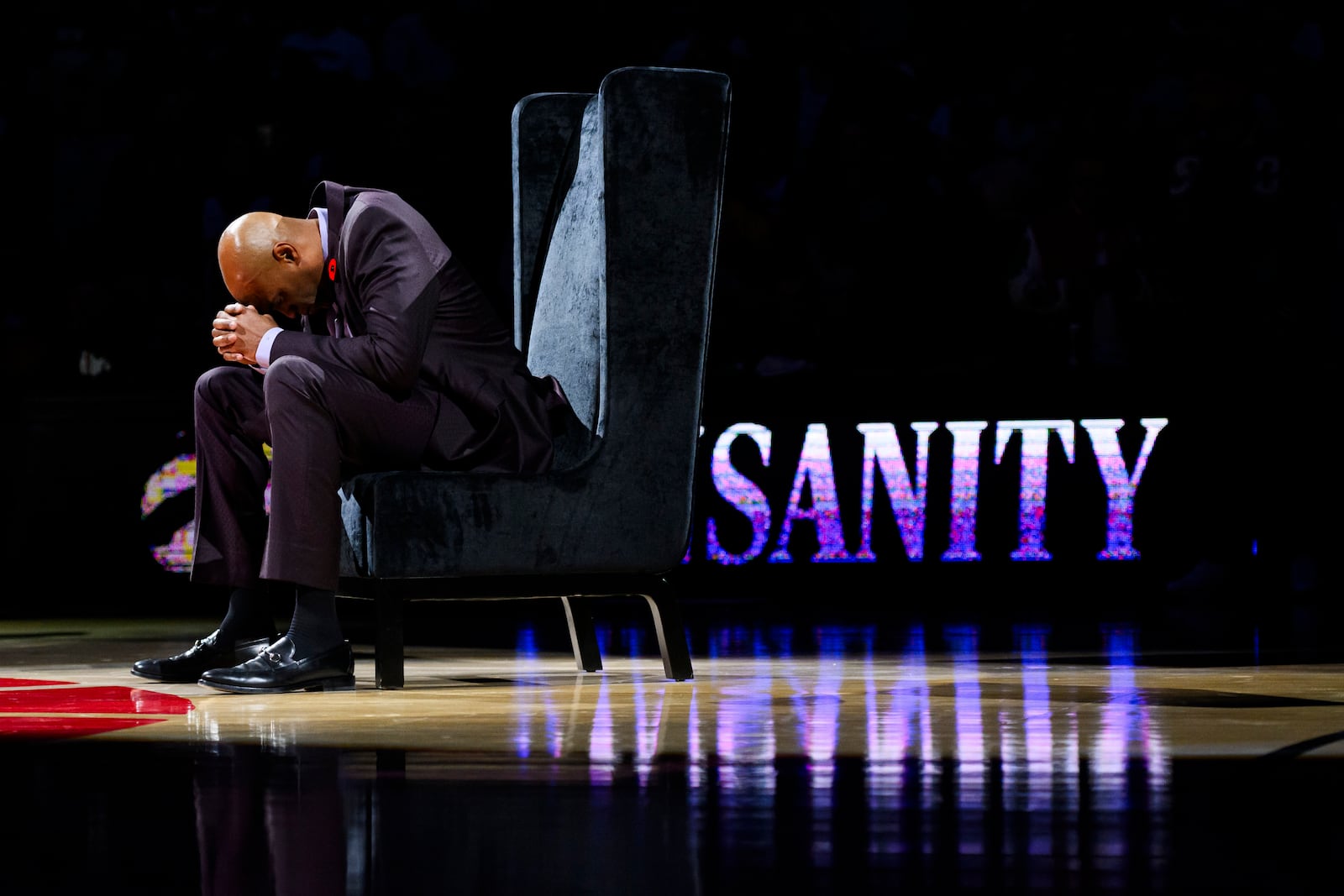 Former Toronto Raptors player Vince Carter reacts during his number retirement ceremony at halftime of an NBA basketball game between the Toronto Raptors and the Sacramento Kings in Toronto on Saturday, Nov. 2, 2024. (Christopher Katsarov/The Canadian Press via AP)