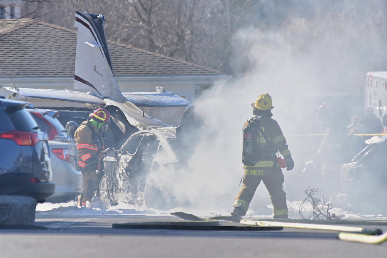 First responders work the scene after a plane crashed in the parking lot of a retirement community in Manheim Township, Pa., Sunday, March 9, 2025. (Suzette Wenger/LNP/LancasterOnline via AP)