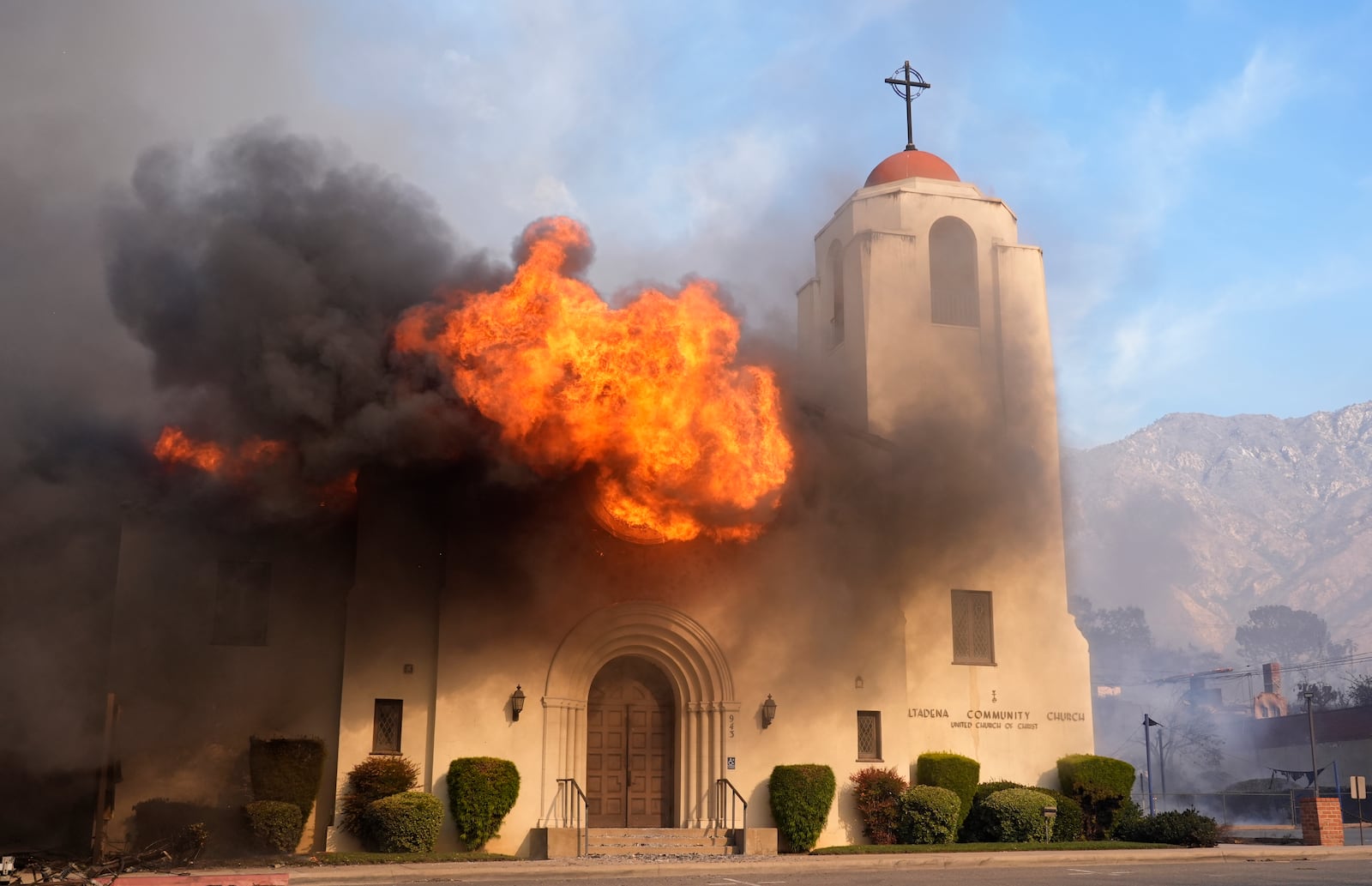 FILE - The Altadena Community Church explodes in flames during the Eaton Fire, Wednesday, Jan. 8, 2025, in Altadena, Calif. (AP Photo/Chris Pizzello, File)