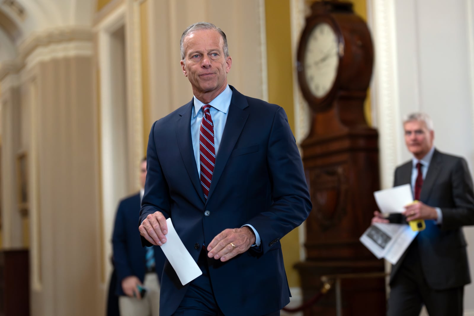 Senate Majority Leader John Thune, R-S.D., arrives to speak to reporters as Republicans work to pass an interim spending bill that would avoid a partial government shutdown and keep federal agencies funded through September, at the Capitol in Washington, Tuesday, March 11, 2025. (AP Photo/J. Scott Applewhite)