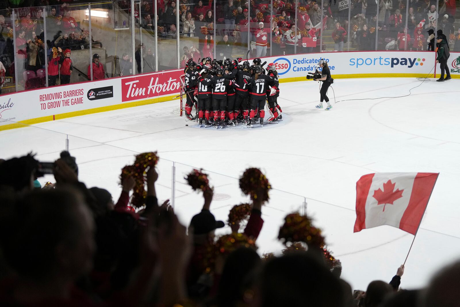 Canada players celebrate after their victory over the United States in the final game of a Rivalry Series in Summerside, Prince Edward Island, Canada, Saturday, Feb. 8, 2025. (Darren Calabrese/The Canadian Press via AP)