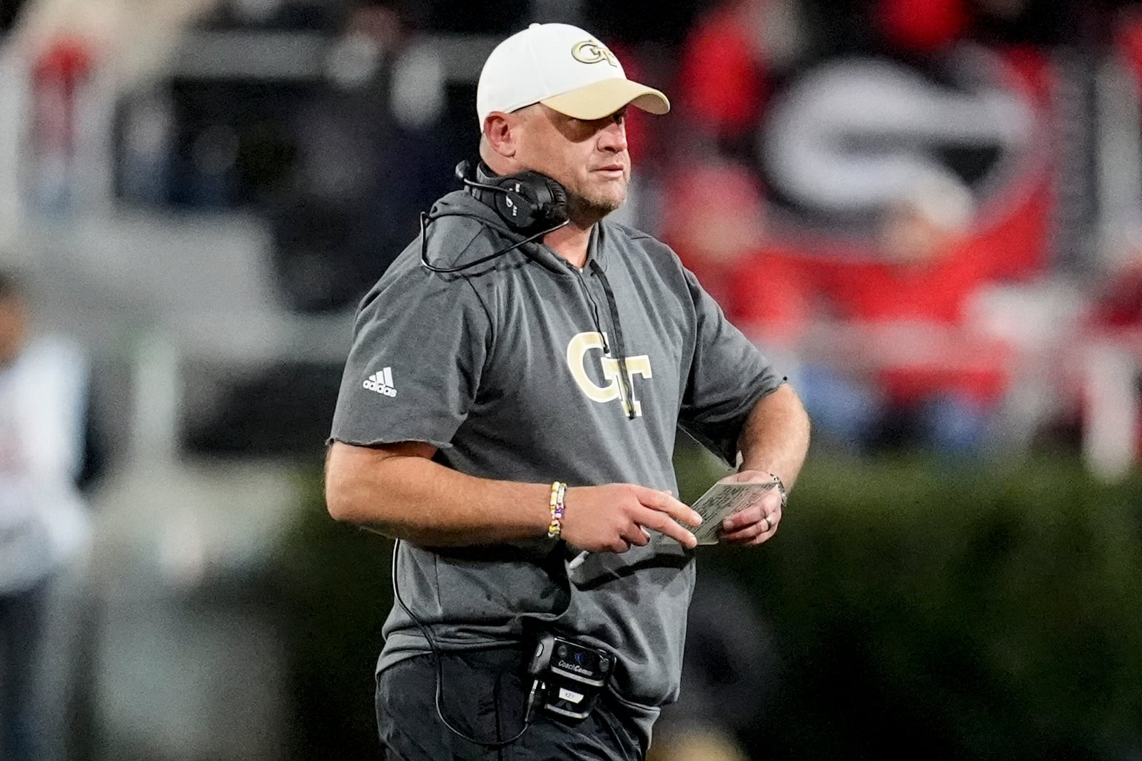 Georgia Tech head coach Brent Key walks on the field during the first half of an NCAA college football game against Georgia, Friday, Nov. 29, 2024, in Athens, Ga. (AP Photo/Mike Stewart)