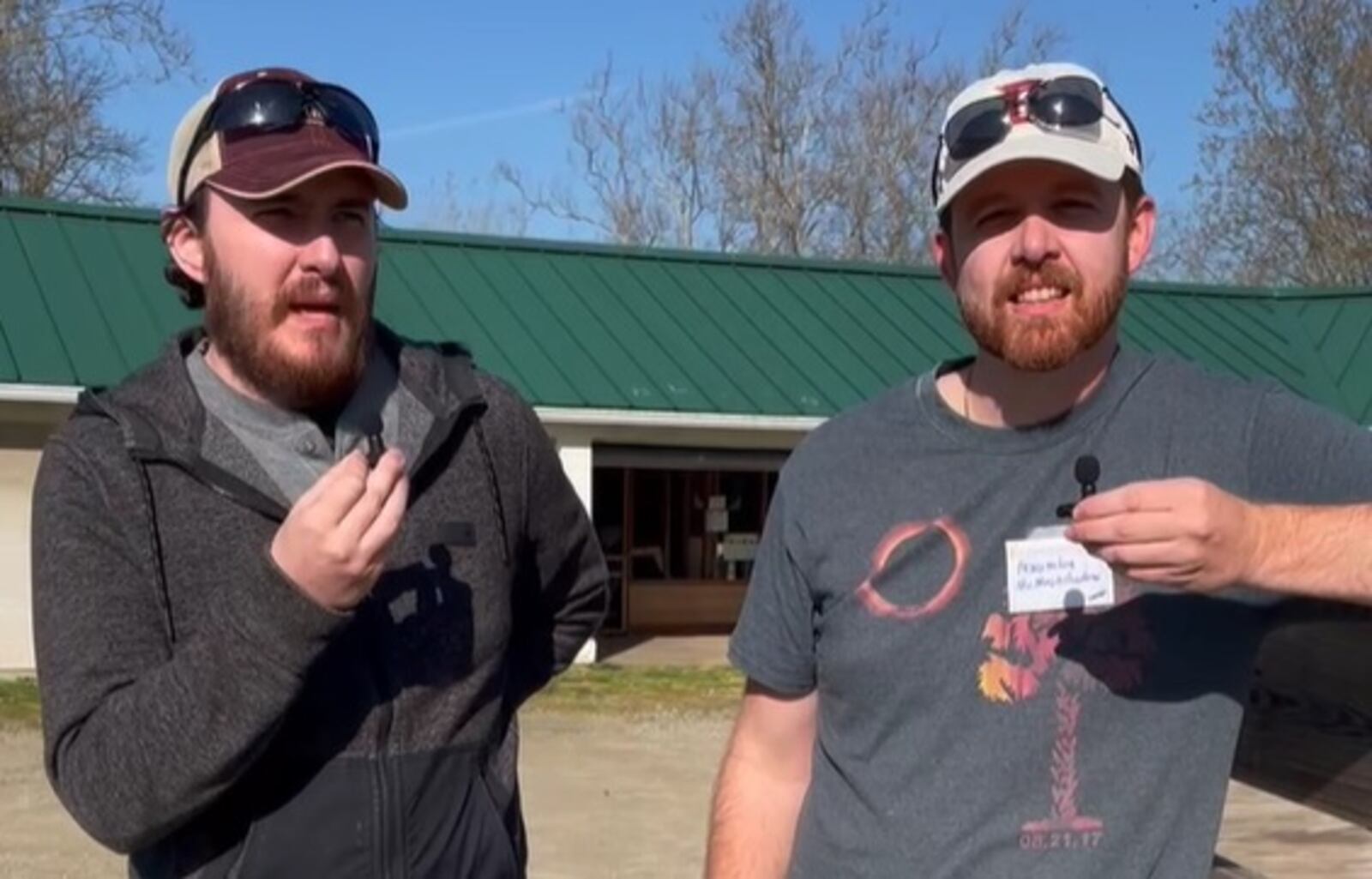 Brothers River, left, and Joshua Rayle of Greensboro, North Carolina, visit Aulwood Audubon Farm in Dayton to watch the total solar eclipse Monday, April 8, 2024. NATALIE JONES/STAFF