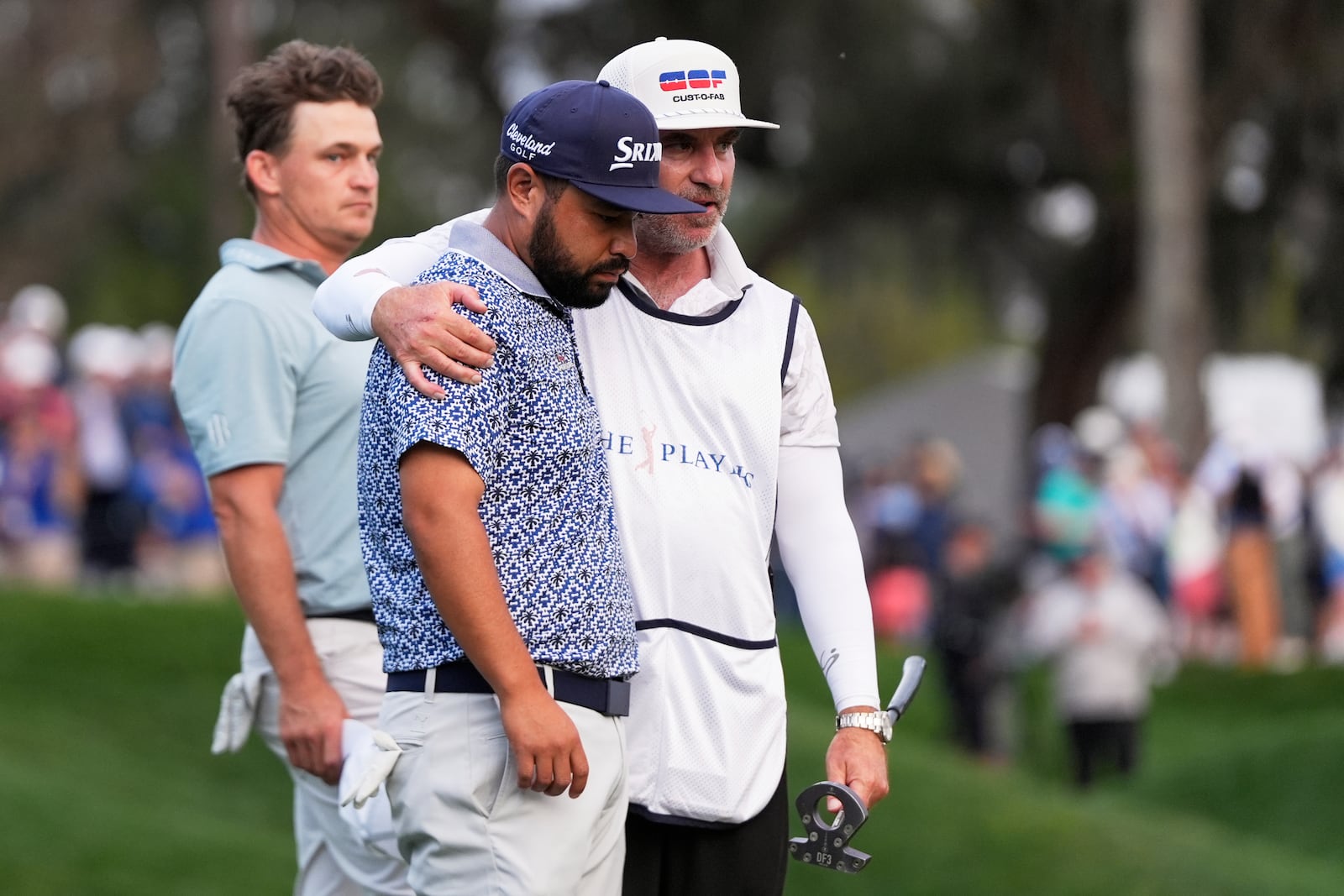 J.J. Spaun, center, reacts after a putt on the 18th green during the final round of The Players Championship golf tournament Sunday, March 16, 2025, in Ponte Vedra Beach, Fla. (AP Photo/Julia Demaree Nikhinson)