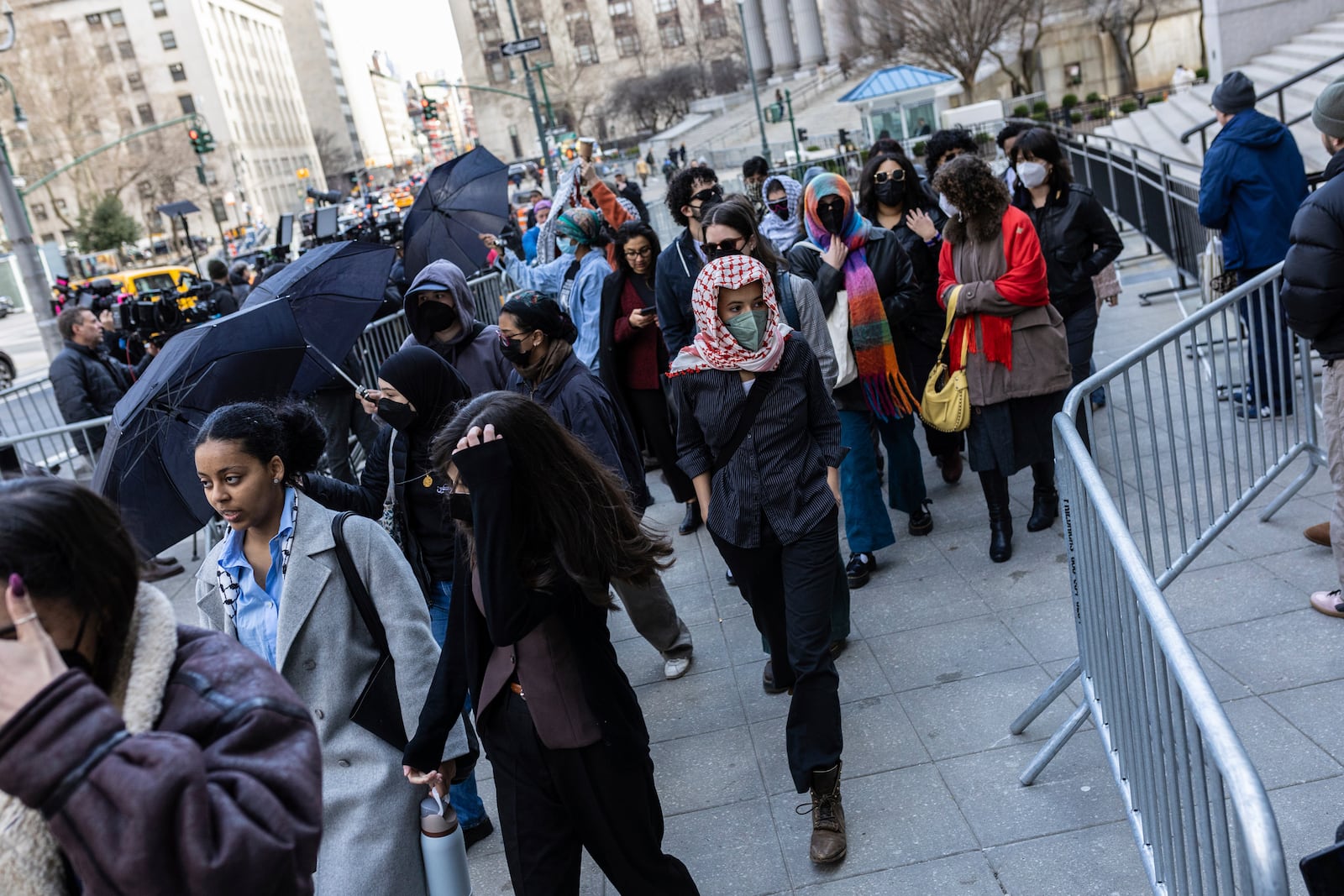 Students from Columbia University arrive at the Manhattan federal court prior to the deportation case of Mahmoud Khalil, Wednesday, March 12, 2025, in New York. (AP Photo/Stefan Jeremiah)