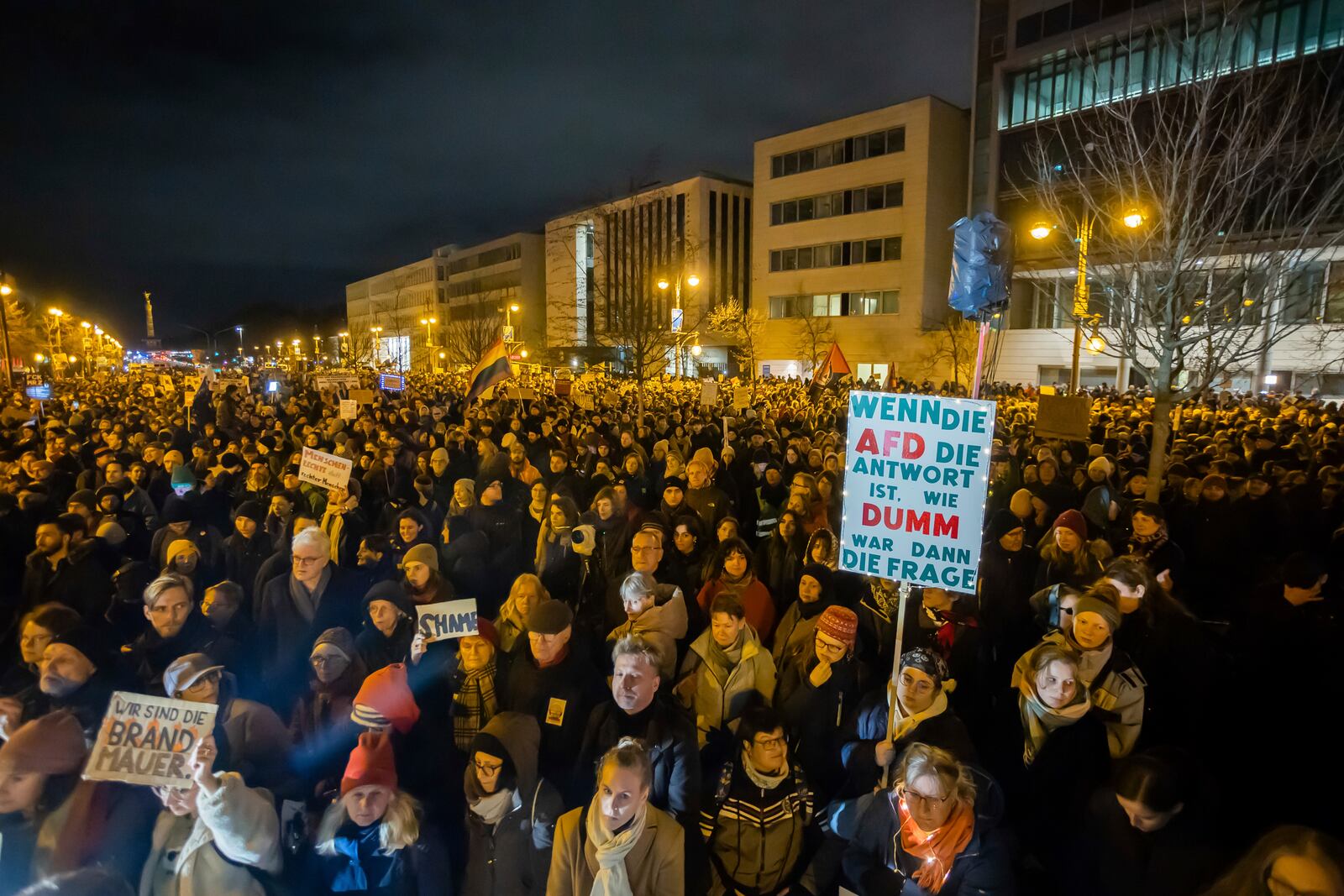 FILE - People protest in front of the headquarters of the Christian Democratic Union party, CDU, against a migration vote at parliament Bundestag with far-right support of the Alternative for Germany party AfD, in Berlin, Jan. 30, 2025. Poster reads: 'If AfD is the answer, how stupid is the question'. ( Christoph Soeder/dpa via AP, File)