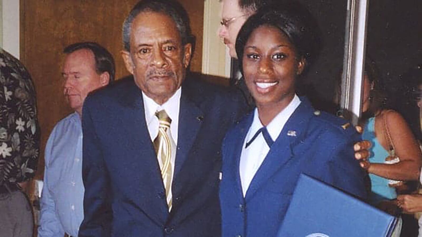 Charlie Ferrell Jr. is the inspiration for Mutt's Sauce LLC, a company created by his granddaughter, Charlynda Scales of Beavercreek. They are shown together in 2004 at her Air Force officer training school graduation. CONTRIBUTED