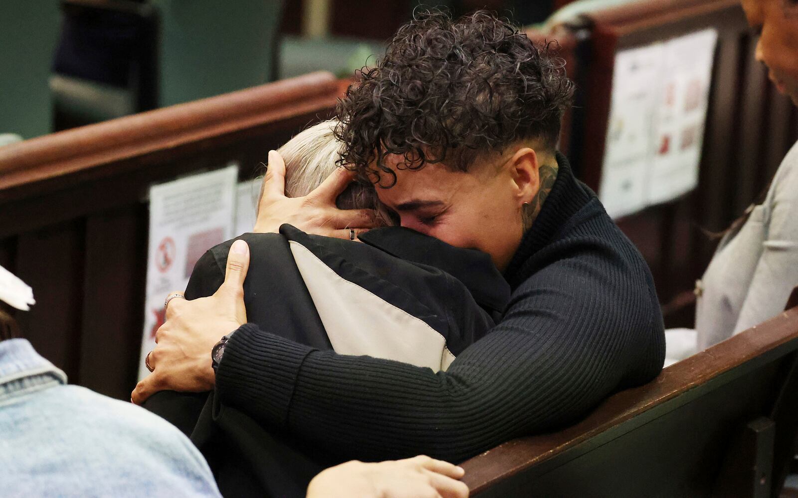 Family members of Jorge Torres, Jr. react at the sentencing of Sarah Boone in a courtroom of the Orange County Courthouse in Orlando, Florida, on Monday, Dec. 2, 2024. (Stephen M. Dowell/Orlando Sentinel via AP)