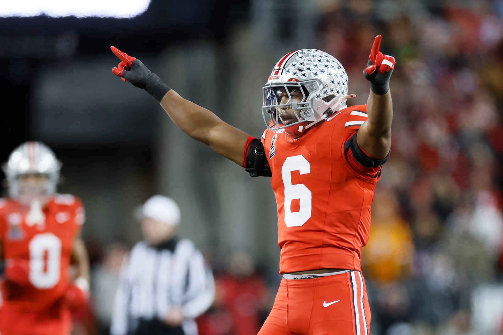 Ohio State defensive back Sonny Styles celebrates after breaking up a pass during the first half in the first round of the College Football Playoff against Tennessee, Saturday, Dec. 21, 2024, in Columbus, Ohio. (AP Photo/Jay LaPrete)