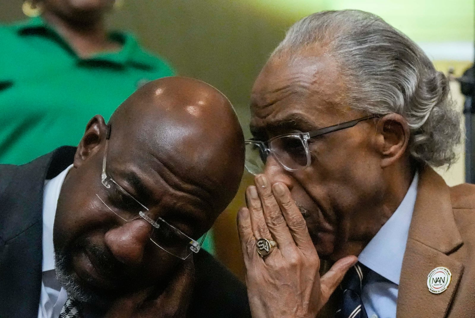 U.S. Sen Raphael Warnock, D-Ga., left, speaks with the Rev. Al Sharpton at the Tabernacle Baptist Church during the 60th anniversary of the march to ensure that African Americans could exercise their constitutional right to vote, Sunday, March 9, 2025, in Selma, Ala. (AP Photo/Mike Stewart)