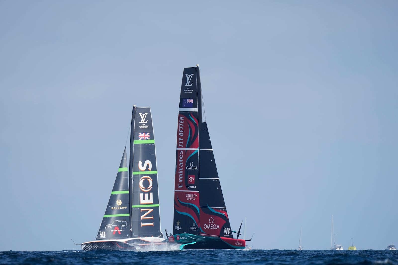 Ineos Britannia and Emirates Team New Zealand race during the Louis Vuitton 37th America's Cup Day 2 race in Barcelona, Spain, Sunday, Oct. 13, 2024. (AP Photo/Bernat Armangue)