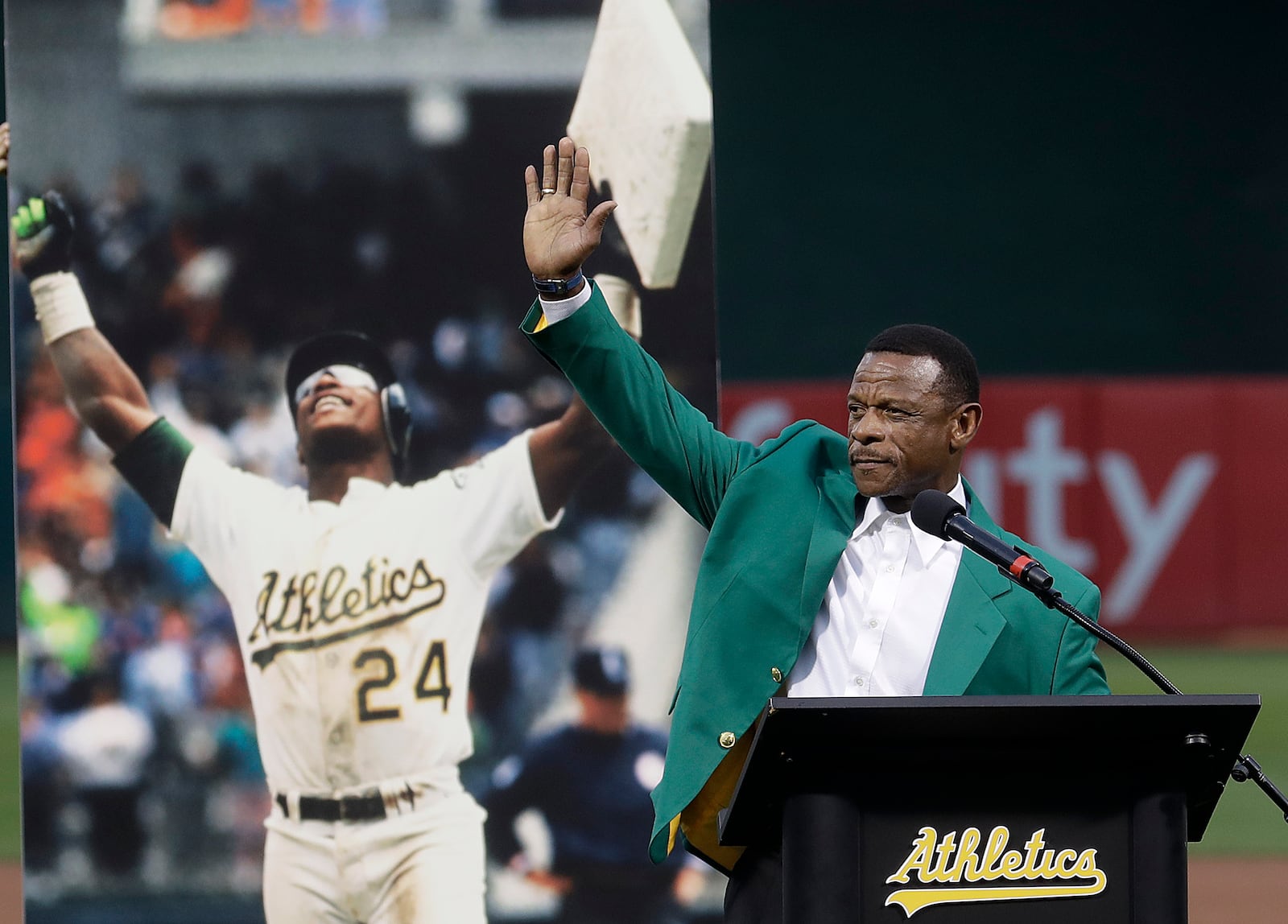 FILE - Former baseball player Rickey Henderson waves after speaking during a ceremony inducting him into the Oakland Athletics' Hall of Fame before a baseball game between the Athletics and the New York Yankees in Oakland, Calif., Sept. 5, 2018. (AP Photo/Jeff Chiu, File)